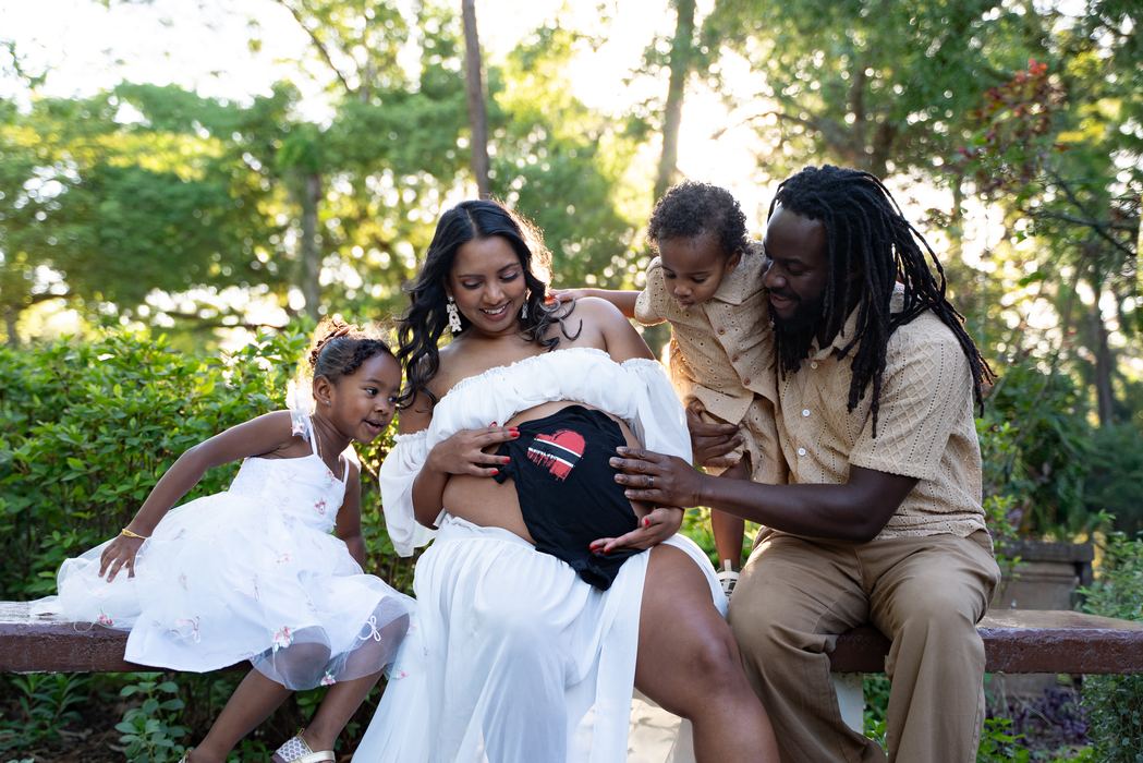 Family portrait outdoors with parents and their children