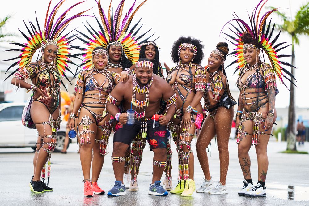 Carnival masqueraders in feathered costumes