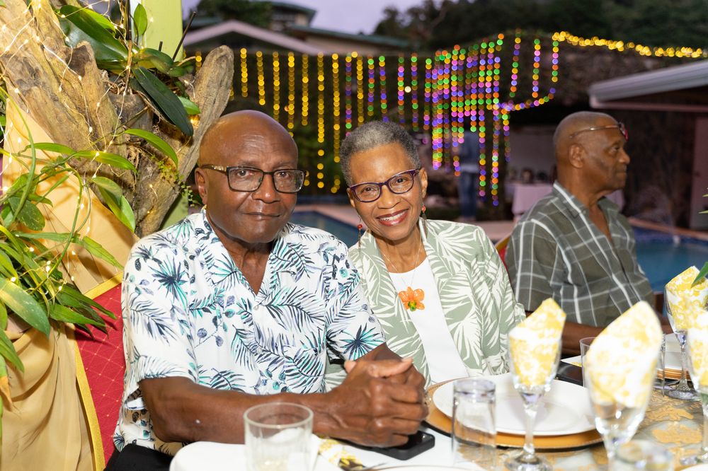Couple at an elegant string-lit dinner celebration