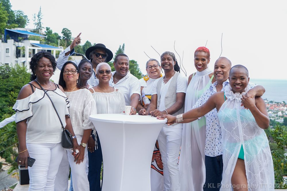Friends gathered for a garden party in white attire