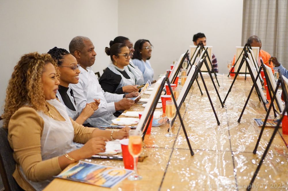 Guests enjoying a paint and sip event