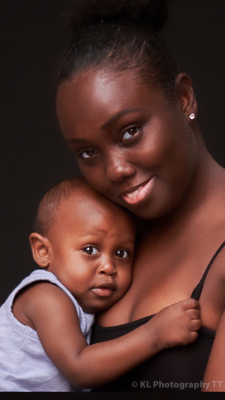 Close portrait of a mother holding her toddler