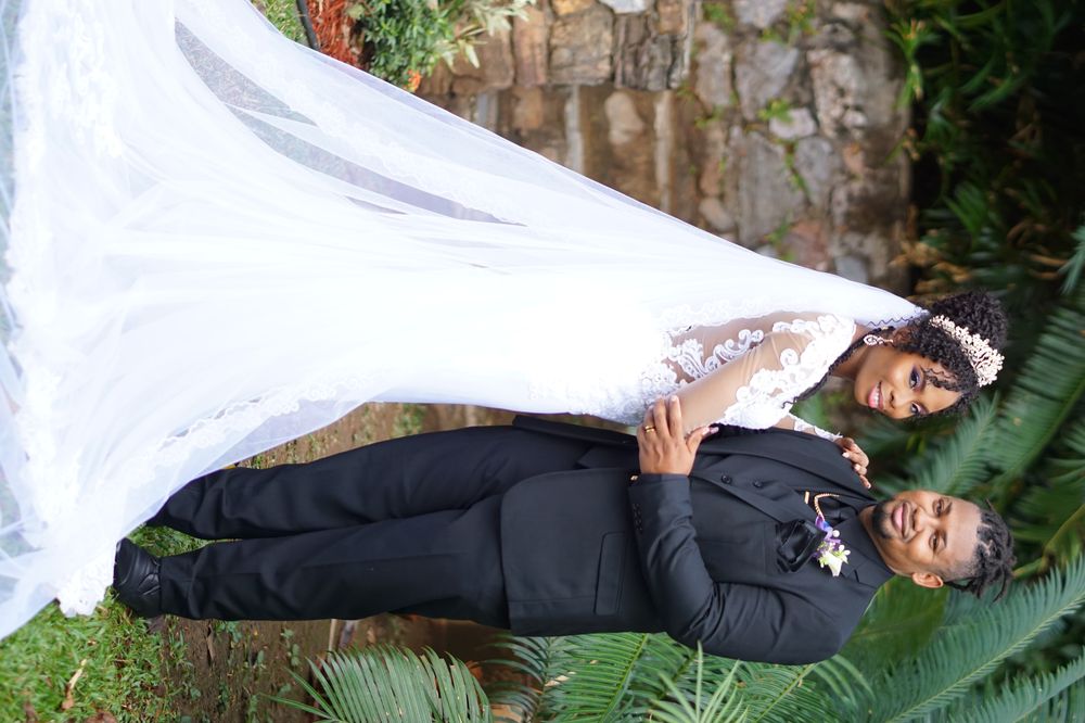 Bride and groom portrait in a lush garden
