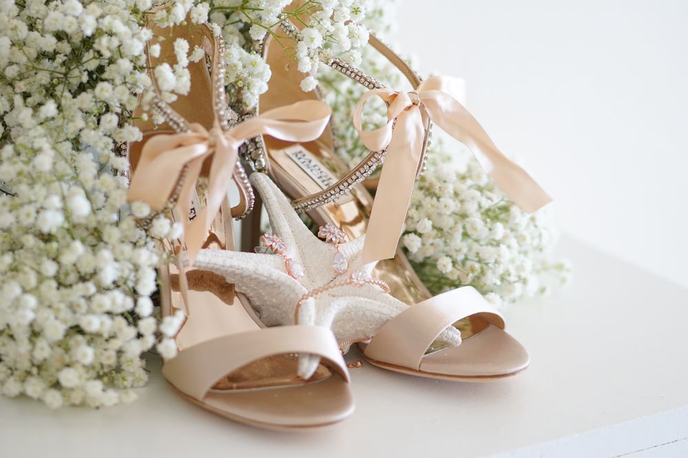 Bridal shoes styled with baby’s breath flowers